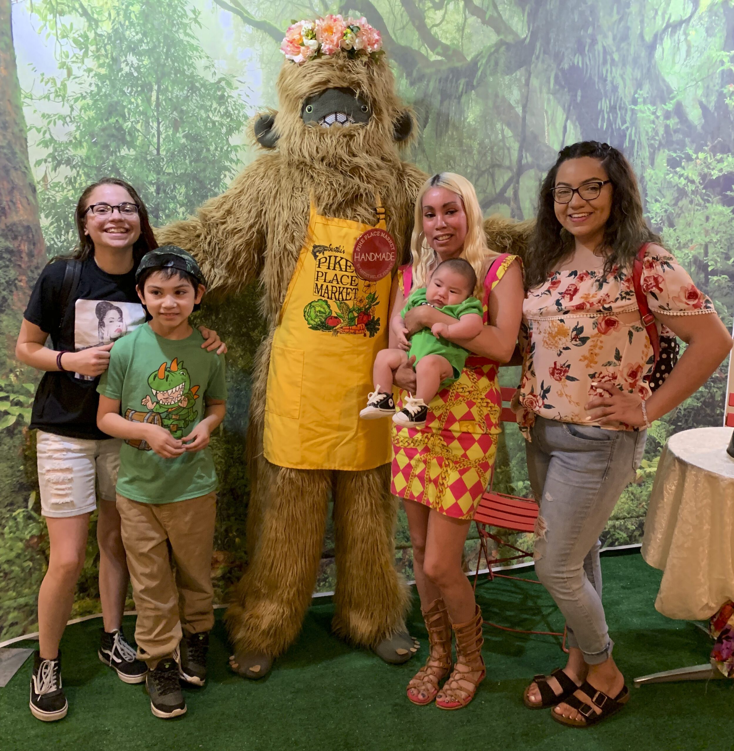 Sasquatch posing with a family at Pike Place Market's signature event Mom's Market Day