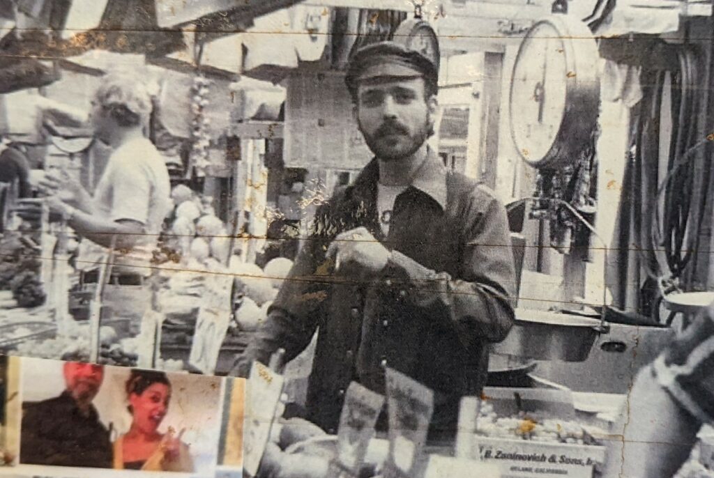 Mario "Mark" Manzo behind the counter at Manzo Brothers Produce in the 1970s.