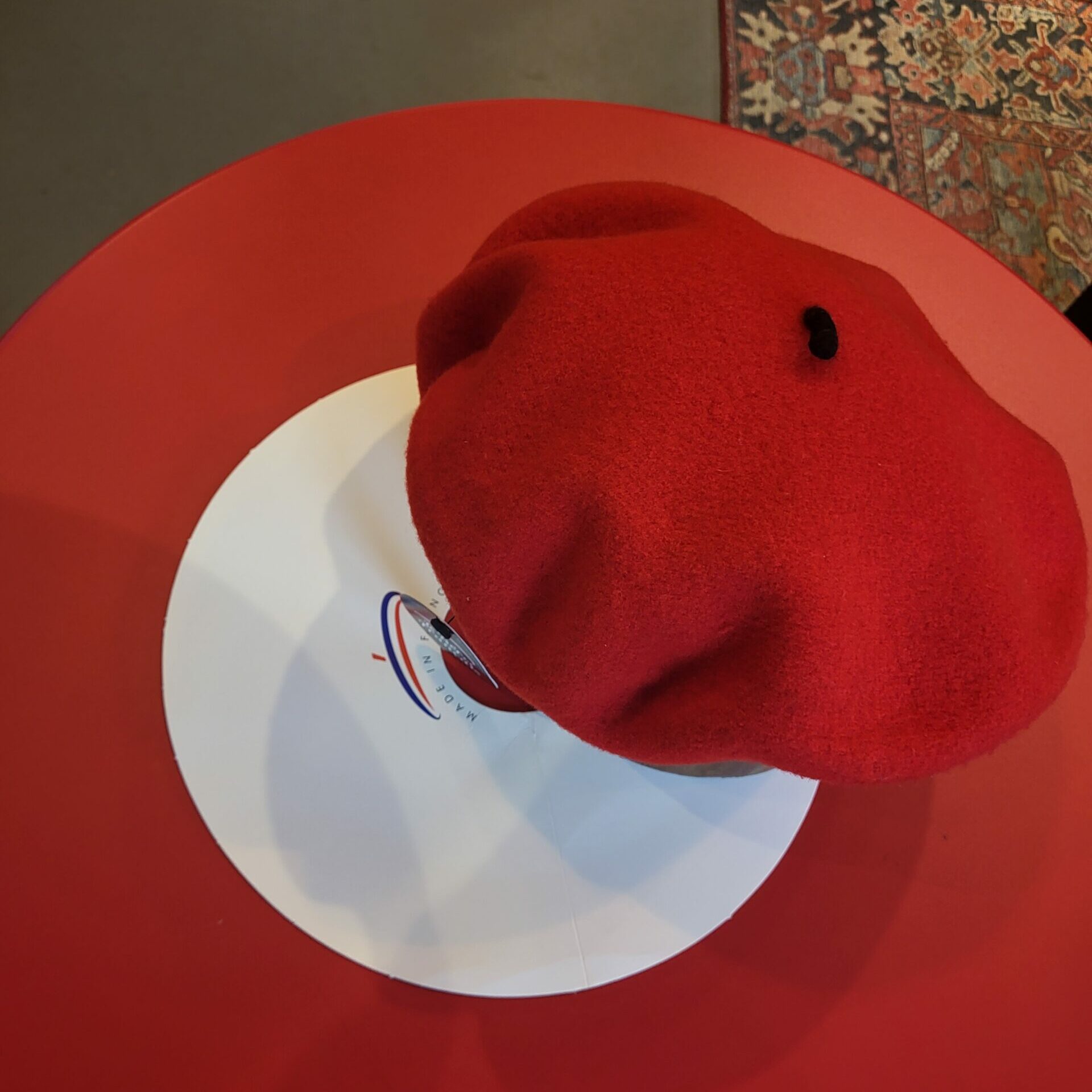 A classic red beret from eclipse hat shop on western avenue in pike place market