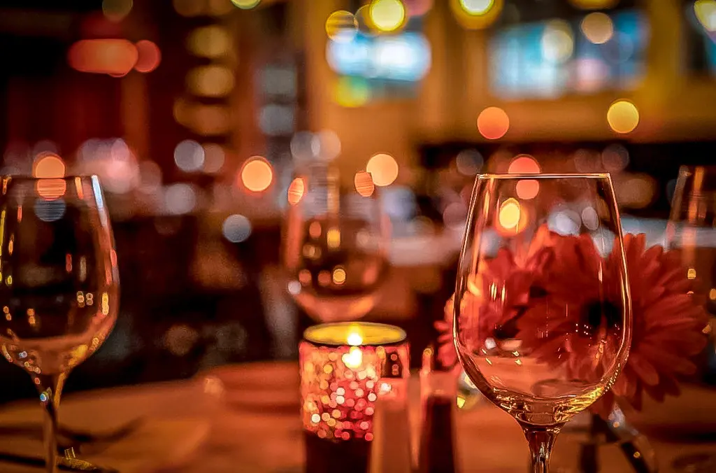 photo of wine glasses inside IL Bistro's romantic dining room in pike place market