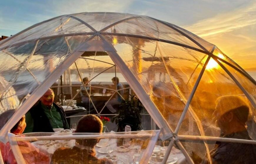 photo of a sunset featuring the le igloo dining experience at maximilien in pike place market
