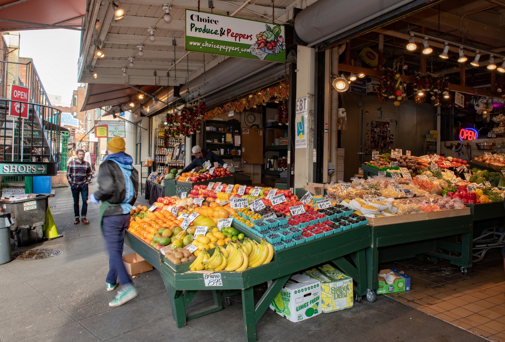 workers outside choice produce a produce stand in Pike Place Market